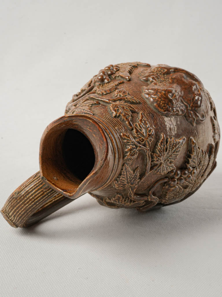 Detailed wine-themed terracotta pitcher
